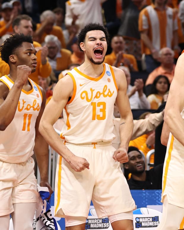 Tennessee forward sUros Plavsic (33) and Olivier Nkamhoua (13) celebrate from the bench during the first half of their game against Duke in the second round of the 2023 NCAA Tournament.